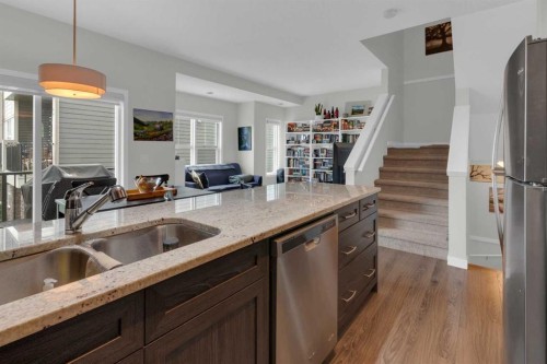 205-250 Fireside View, Cochrane, AB - Indoor Photo Showing Kitchen With Double Sink