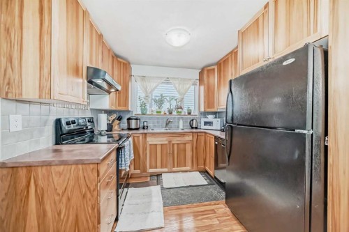 83 Whitworth Way Ne, Calgary, AB - Indoor Photo Showing Kitchen With Double Sink