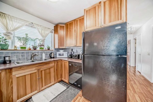 83 Whitworth Way Ne, Calgary, AB - Indoor Photo Showing Kitchen With Double Sink