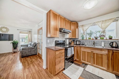 83 Whitworth Way Ne, Calgary, AB - Indoor Photo Showing Kitchen With Double Sink