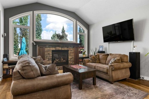 2170 High Country Rise Nw, High River, AB - Indoor Photo Showing Living Room With Fireplace