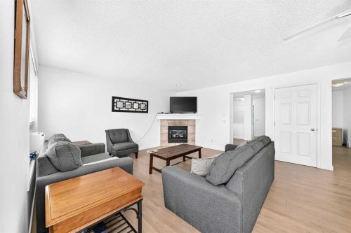 124 West Lakeview Drive, Chestermere, AB - Indoor Photo Showing Living Room With Fireplace