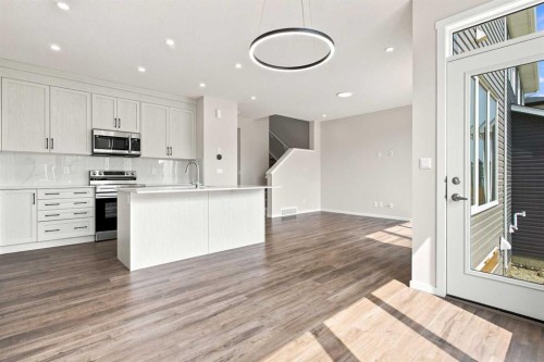4041 Southwinds Way Sw, Airdrie, AB - Indoor Photo Showing Kitchen With Upgraded Kitchen