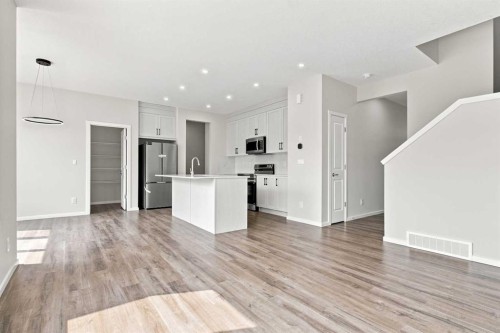 4041 Southwinds Way Sw, Airdrie, AB - Indoor Photo Showing Kitchen With Upgraded Kitchen