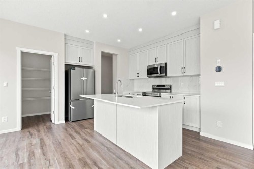 4041 Southwinds Way Sw, Airdrie, AB - Indoor Photo Showing Kitchen With Stainless Steel Kitchen