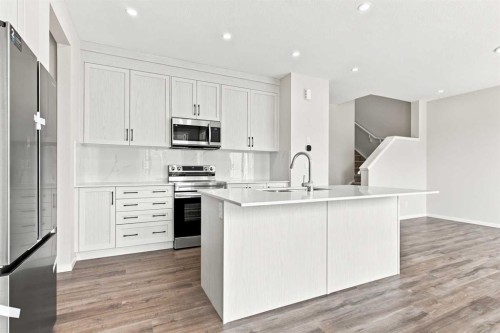 4041 Southwinds Way Sw, Airdrie, AB - Indoor Photo Showing Kitchen With Upgraded Kitchen