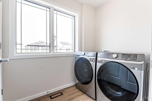 4041 Southwinds Way Sw, Airdrie, AB - Indoor Photo Showing Laundry Room