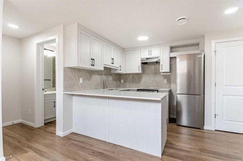 4041 Southwinds Way Sw, Airdrie, AB - Indoor Photo Showing Kitchen With Stainless Steel Kitchen