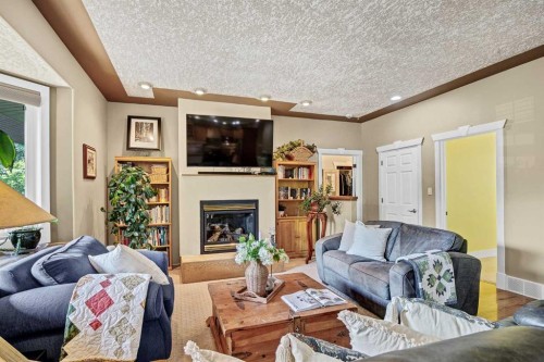 280166 Twp Rd 240, Chestermere, AB - Indoor Photo Showing Living Room With Fireplace