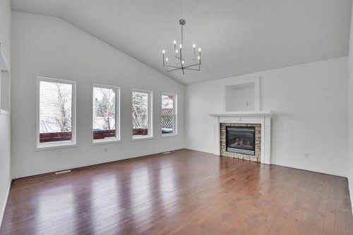 89 Everoak Drive Sw, Calgary, AB - Indoor Photo Showing Living Room With Fireplace