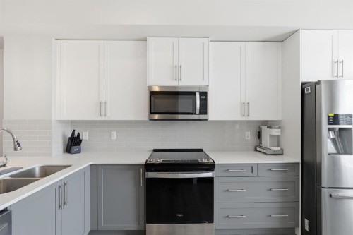 187 Legacy Common Se, Calgary, AB - Indoor Photo Showing Kitchen With Double Sink With Upgraded Kitchen