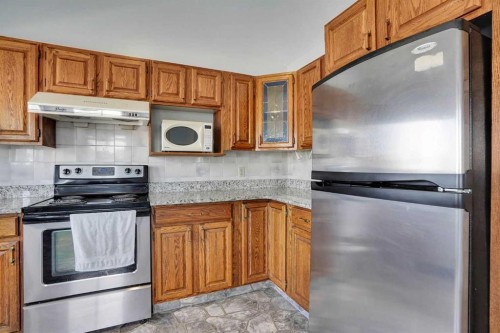 21 La Valencia Green Ne, Calgary, AB - Indoor Photo Showing Kitchen With Stainless Steel Kitchen