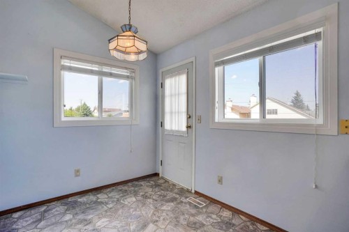 21 La Valencia Green Ne, Calgary, AB - Indoor Photo Showing Other Room