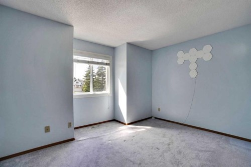 21 La Valencia Green Ne, Calgary, AB - Indoor Photo Showing Other Room
