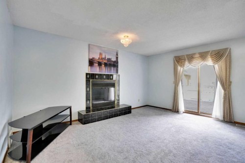 21 La Valencia Green Ne, Calgary, AB - Indoor With Fireplace