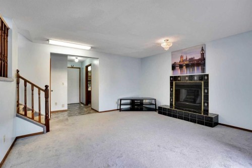 21 La Valencia Green Ne, Calgary, AB - Indoor With Fireplace