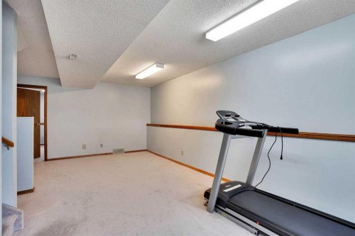 21 La Valencia Green Ne, Calgary, AB - Indoor Photo Showing Gym Room