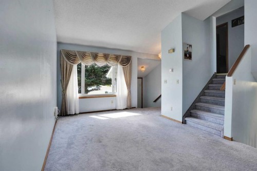 21 La Valencia Green Ne, Calgary, AB - Indoor Photo Showing Other Room