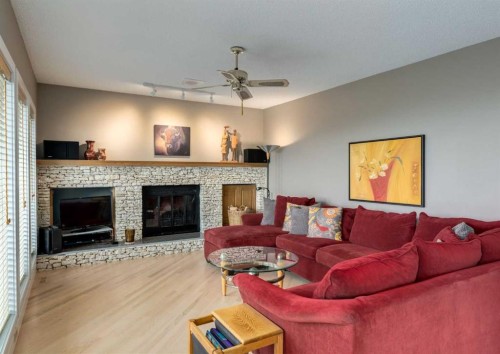 111 Hawksbrow Drive Nw, Calgary, AB - Indoor Photo Showing Living Room With Fireplace