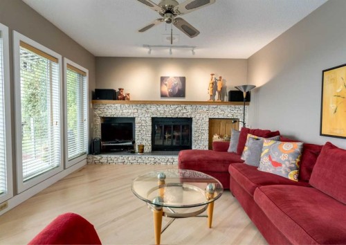 111 Hawksbrow Drive Nw, Calgary, AB - Indoor Photo Showing Living Room With Fireplace