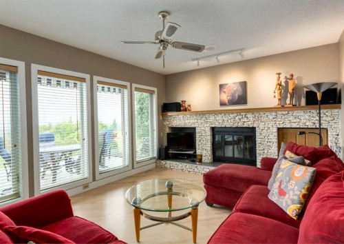 111 Hawksbrow Drive Nw, Calgary, AB - Indoor Photo Showing Living Room With Fireplace