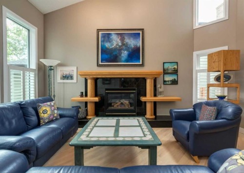 111 Hawksbrow Drive Nw, Calgary, AB - Indoor Photo Showing Living Room With Fireplace