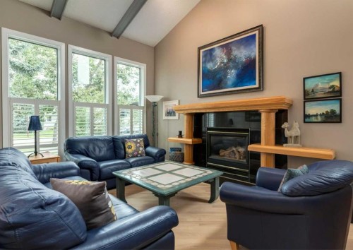 111 Hawksbrow Drive Nw, Calgary, AB - Indoor Photo Showing Living Room With Fireplace