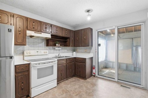56 Pinecliff Close Ne, Calgary, AB - Indoor Photo Showing Kitchen With Double Sink