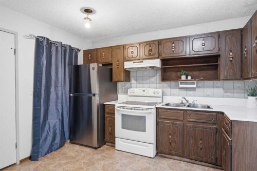 56 Pinecliff Close Ne, Calgary, AB - Indoor Photo Showing Kitchen With Double Sink