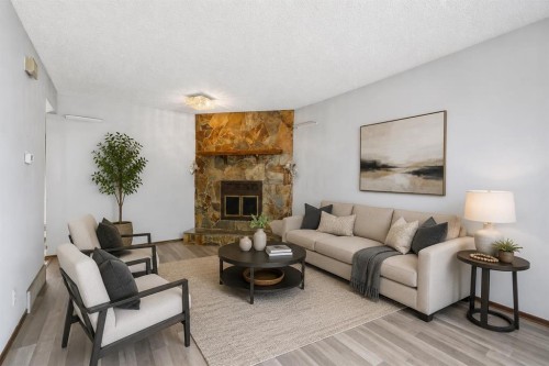 56 Pinecliff Close Ne, Calgary, AB - Indoor Photo Showing Living Room With Fireplace