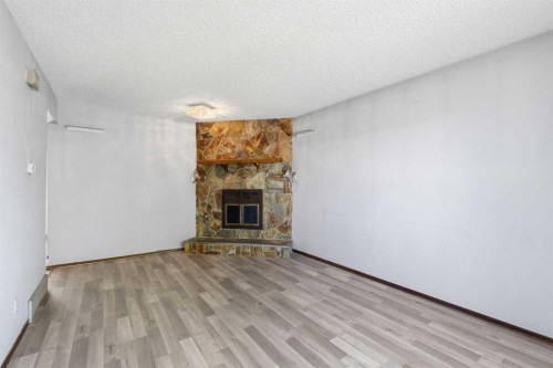 56 Pinecliff Close Ne, Calgary, AB - Indoor With Fireplace