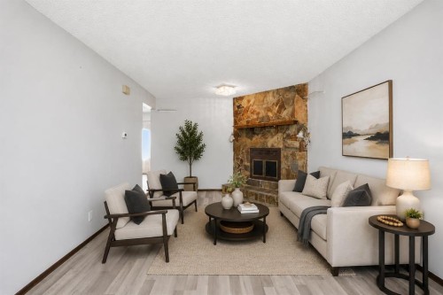56 Pinecliff Close Ne, Calgary, AB - Indoor Photo Showing Living Room With Fireplace