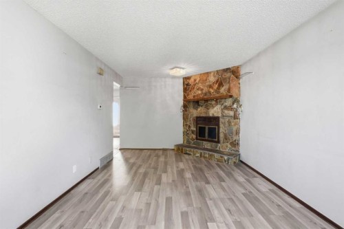 56 Pinecliff Close Ne, Calgary, AB - Indoor Photo Showing Living Room With Fireplace