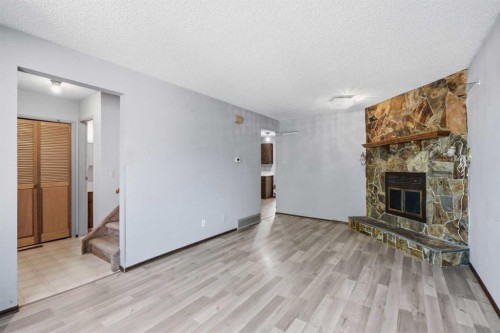 56 Pinecliff Close Ne, Calgary, AB - Indoor With Fireplace