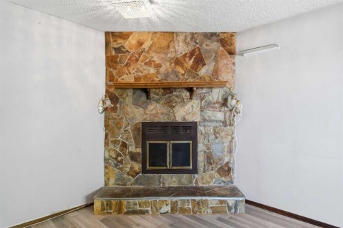 56 Pinecliff Close Ne, Calgary, AB - Indoor With Fireplace