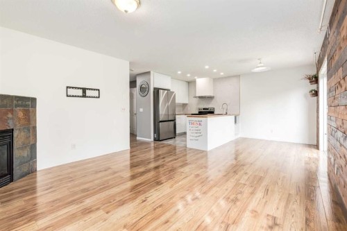 87 Royal Elm Way Nw, Calgary, AB - Indoor With Fireplace