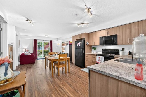 5102-755 Copperpond Boulevard Se, Calgary, AB - Indoor Photo Showing Kitchen With Double Sink