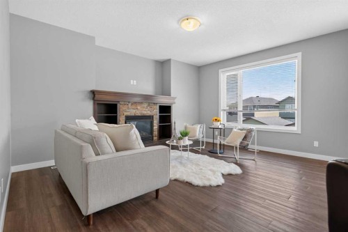 47 Evanscrest Way Nw, Calgary, AB - Indoor Photo Showing Living Room With Fireplace