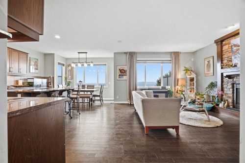 113 Sunset View, Cochrane, AB - Indoor Photo Showing Other Room With Fireplace