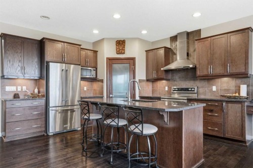 113 Sunset View, Cochrane, AB - Indoor Photo Showing Kitchen With Stainless Steel Kitchen With Upgraded Kitchen