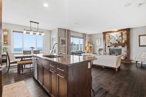 113 Sunset View, Cochrane, AB - Indoor With Fireplace