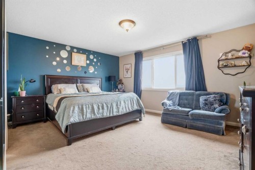 113 Sunset View, Cochrane, AB - Indoor Photo Showing Bedroom