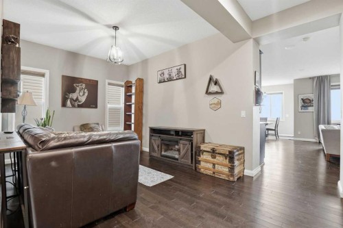 113 Sunset View, Cochrane, AB - Indoor With Fireplace