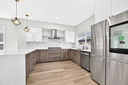 856 Midtown Drive Sw, Airdrie, AB - Indoor Photo Showing Kitchen With Stainless Steel Kitchen With Upgraded Kitchen