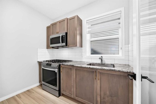 856 Midtown Drive Sw, Airdrie, AB - Indoor Photo Showing Kitchen