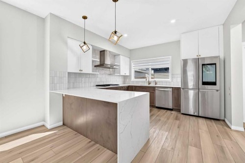 856 Midtown Drive Sw, Airdrie, AB - Indoor Photo Showing Kitchen With Stainless Steel Kitchen With Upgraded Kitchen