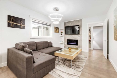 23 Sussex Crescent Sw, Calgary, AB - Indoor Photo Showing Living Room With Fireplace