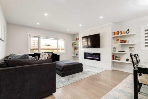 23 Sussex Crescent Sw, Calgary, AB - Indoor Photo Showing Living Room With Fireplace