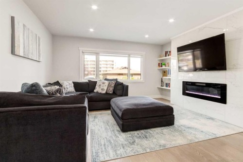 23 Sussex Crescent Sw, Calgary, AB - Indoor Photo Showing Living Room With Fireplace