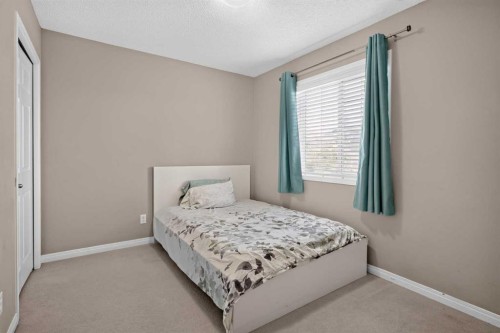 189 Bridleridge View Sw, Calgary, AB - Indoor Photo Showing Bedroom